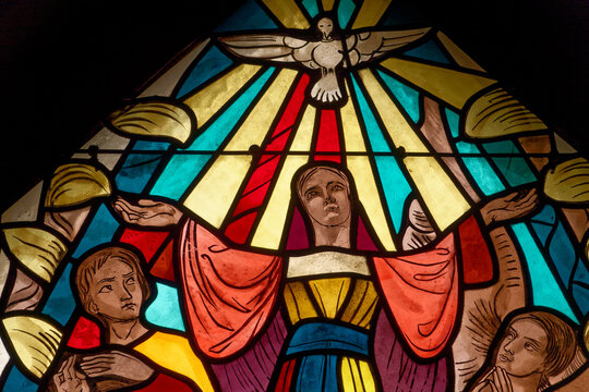 Stained glass window of the Assumption of the Virgin Mary. Vitrail de l'Assomption de la Vierge Marie. Annecy - France