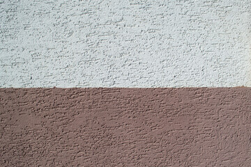 Plastered wall half painted pastel brown and white, wall cladding, wall covering, cracks and scratches texture