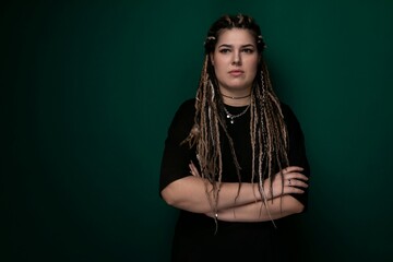 Woman With Dreadlocks Standing With Arms Crossed