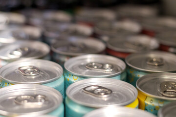 
metal beer or juice cans on store shelves
