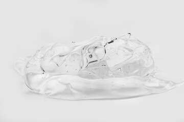 Clear gel serum texture. Liquid skincare cream background. Cosmetic gel product with bubbles close up