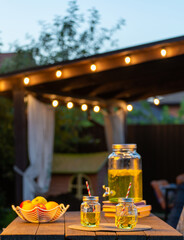 Drink station for an outdoor party. Abstract Night Festival in garden with bokeh for background usage.