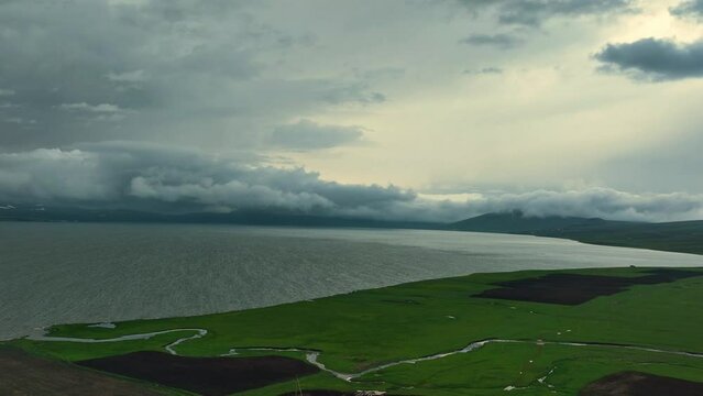 Aerial view of largest Paravani lake in Georgia, Samtskhe-Javakheti region. drone shot captures the stunning volcanic landscape, also known as Georgian Arctic.