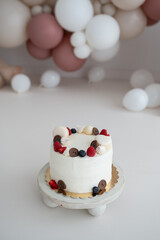 Happy birthday cake with berries, macrons and chocolate