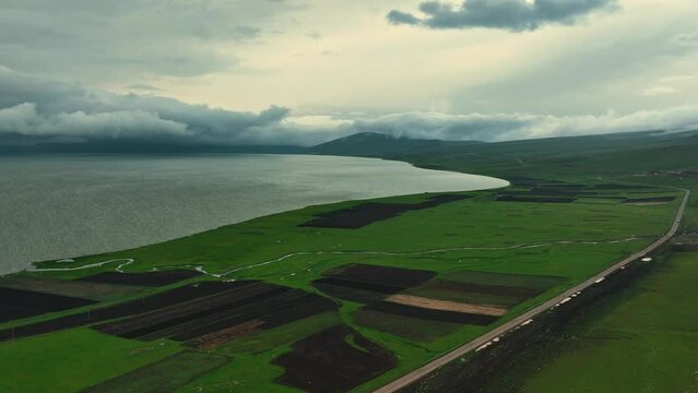 Aerial view of largest Paravani lake in Georgia, Samtskhe-Javakheti region. drone shot captures the stunning volcanic landscape, also known as Georgian Arctic.
