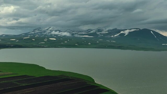 Aerial view of largest Paravani lake in Georgia, Samtskhe-Javakheti region. drone shot captures the stunning volcanic landscape, also known as Georgian Arctic.