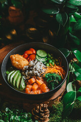 A close-up shot of a poke bowl filled with fresh salmon, avocado, rice, vegetables, and other...