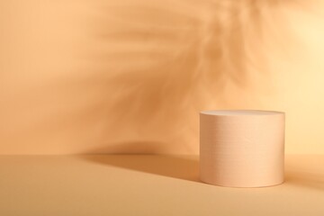 Presentation of product. Podium and shadows on orange background. Space for text