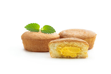 Custard filled mini cakes isolated on white