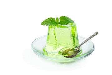 Green jelly on glass saucer isolated on white
