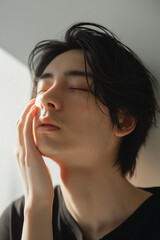 Fototapeta premium Young Man Smiling and Touching His Face