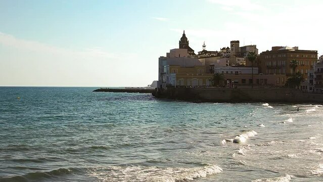 San Sebasti&aacute;n beach with Sant Bartomeu i Santa Tecla church in background