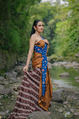 Asian woman wearing "Kemben" batik cloth