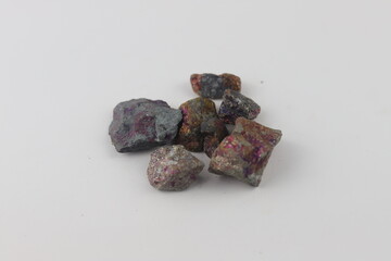 Geologist holding green tourmaline crystals in open hand