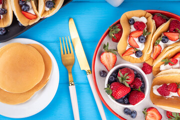 Pancake tacos, sweet breakfast tacos with whipped cream and berry