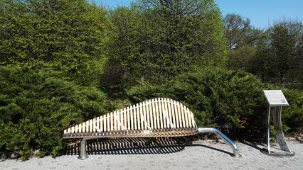 Gilded bench in a summer park
