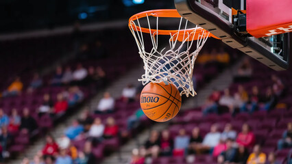 Fototapeta premium basketball ball hitting the hoop