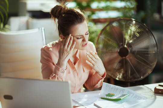 unhappy modern 40 years old accountant woman at work