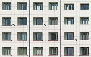 A fragment of a city office building with windows