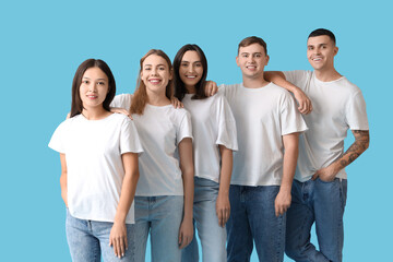 Obraz premium Group of young people in stylish jeans on blue background