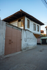 Traditional Kula houses with wooden structure in Turkish and Ottoman architectural style, Manisa, Türkiye. Historical buildings and houses on the streets of Manisa.