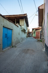 Naklejka premium Traditional Kula houses with wooden structure in Turkish and Ottoman architectural style, Manisa, Türkiye. Historical buildings and houses on the streets of Manisa.