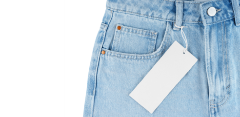 Front pocket, small pocket and metal button of blue jeans pants with blank label tag isolated on white, transparent background mockup, template. Fashion concept, business, shopping, sale
