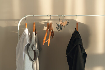 Clothes hanging on a clothes rack indoors