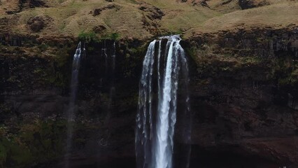 Aerial view of Seljalandsfoss waterfall in Iceland's southern region during summer, a popular tourism location.