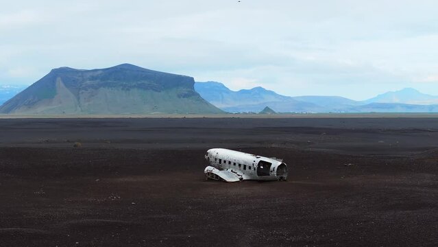 Aerial view of the Solheimasandur Plane Wreck in Iceland. Wrecked old plane Dakota on the black sand beach, south coast of Iceland