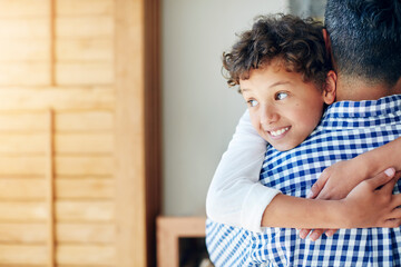 Happy, boy and father hugging in house with love, bonding and together for relationship with caring embrace. Relaxing, family and apartment for childcare or parent, affection and kid smiling in house