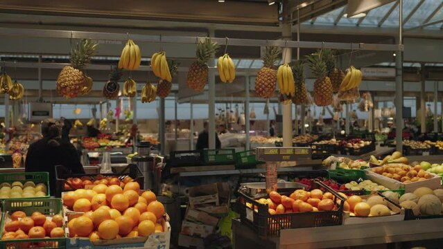 Porto, Portugal - Early morning at Bolh&atilde;o Market in Porto, the fruit, meat and vegetable vendors have already opened their stalls.