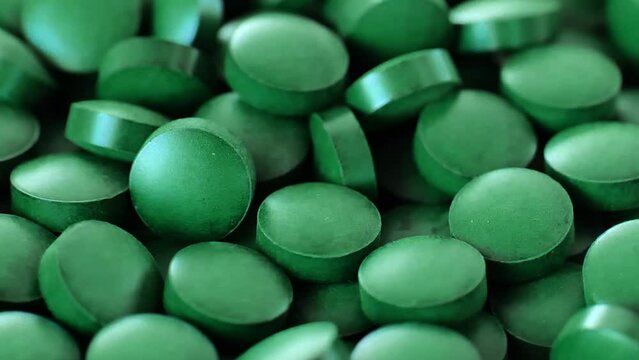Spirulina algae green tablets.Natural source of iodine. Super food . Slow rotation.Supplements for health and longevity. Vitamins and dietary supplements. 4k footage