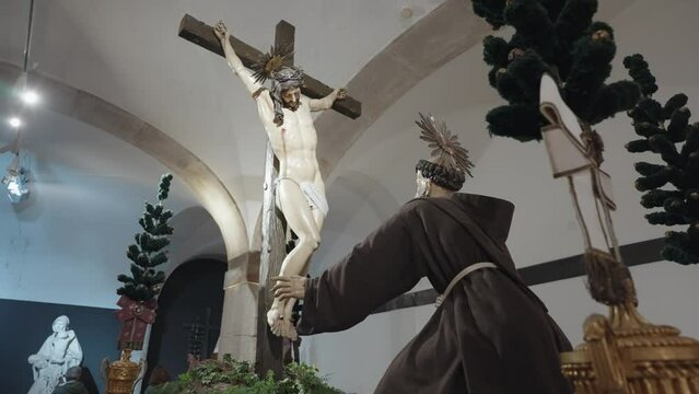 Porto, Portugal - April 8, 2024: The statues of Jesus and Saint Francis inside the Catacombs of Igreja de S&atilde;o Francisco, Porto