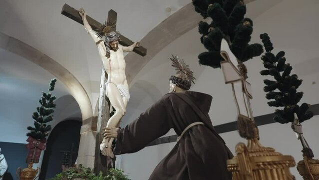 Porto, Portugal - April 8, 2024: The statues of Jesus and Saint Francis inside the Catacombs of Igreja de S&atilde;o Francisco, Porto