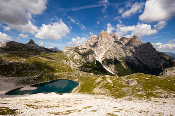 Summer sunny day at Dolomitic Alps: turquoise hue see-through water of Laghi dei Piani