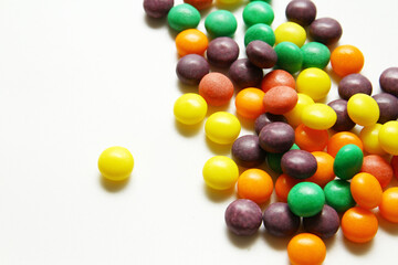 Close up shot of chewy colorful candy on white background