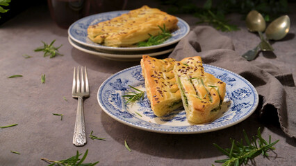 A rustic charm unfolds with a savory spinach pie on a vintage plate