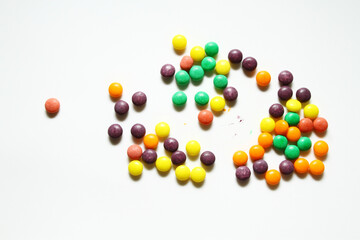 Close up shot of chewy colorful candy on white background