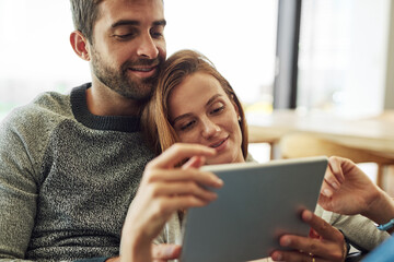 Happy, couple and hug with tablet for streaming app, scrolling and movie selection at home. Smile, man and woman with technology and digital subscription for bonding, search and entertainment choice