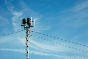 broadcast pole and telephone transceiver with blue sky, public loudspeakers broadcast