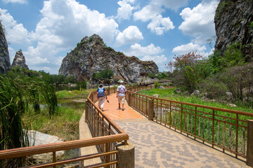 Tourists walk along natural trails surroundings of the mountains.