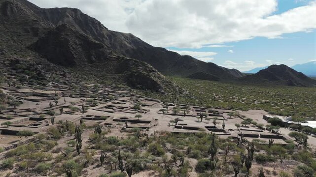 Scenic aerial above the Quilmes Ruins in desert landscape, Argentina. Archaeological sight.