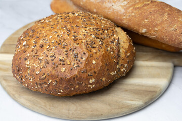 Freshly baked bread on a cutting board. High quality photo