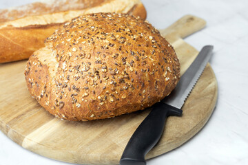 Freshly baked bread on a cutting board. High quality photo