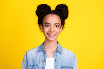 Photo of nice young girl beaming smile wear denim shirt isolated on yellow color background