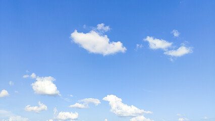 Aerial view of fluffy clouds and blue sky over the city