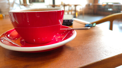 A delicious, natural cocoa drink with grated chocolate and milk in a glass mug is a source of vitamins and energy.