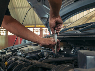 Fototapeta premium Close up Man hands fixing Car machinery vehicle mechanical service. Mechanic man hands repairing car auto repair shop. open vehicle hood checking up auto mobile. Vehicle Car maintenance engineer.