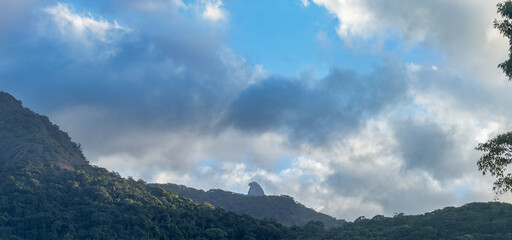 Dramatic Skies Over Lush Green Tropical Mountain Landscape